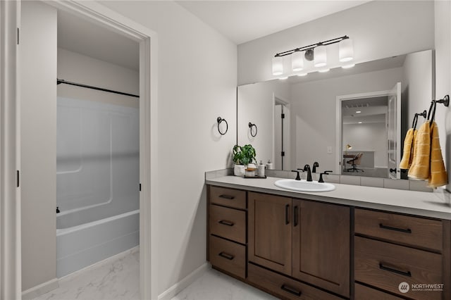 bathroom featuring vanity and shower / bath combination