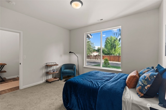 bedroom featuring wood-type flooring