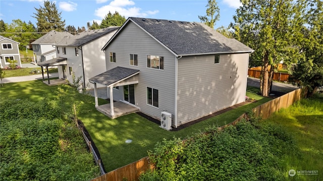 back of property featuring a yard and a patio