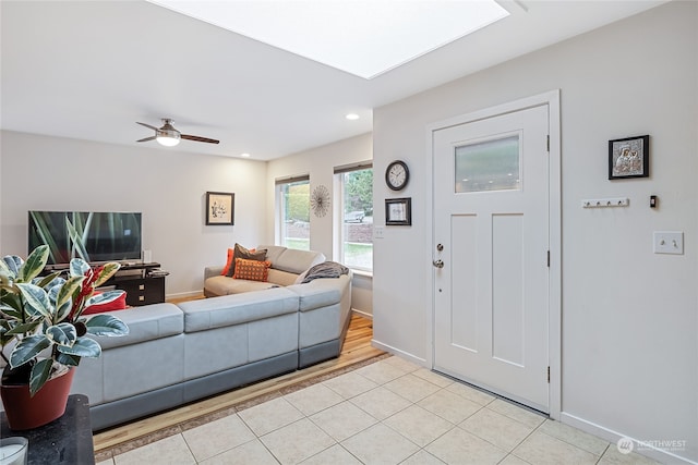 interior space with ceiling fan