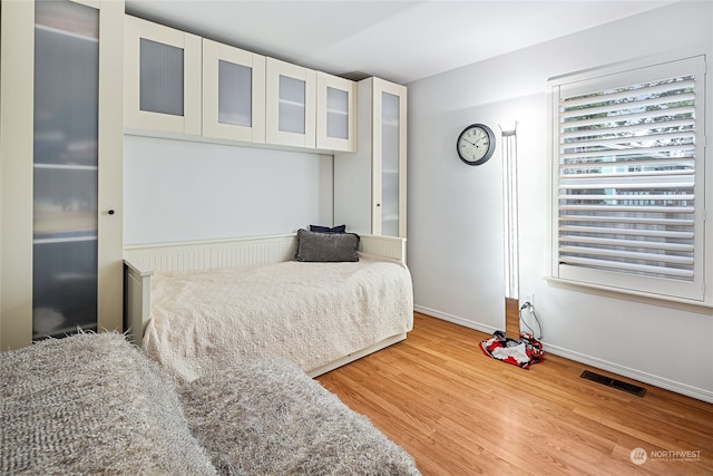 bedroom featuring wood-type flooring