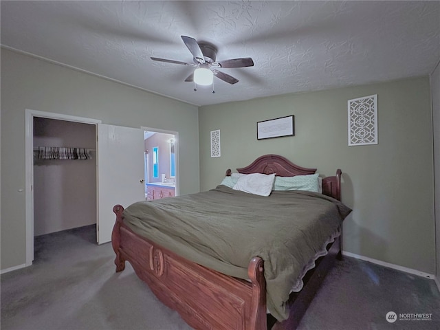 carpeted bedroom with ensuite bath, ceiling fan, a closet, and a textured ceiling