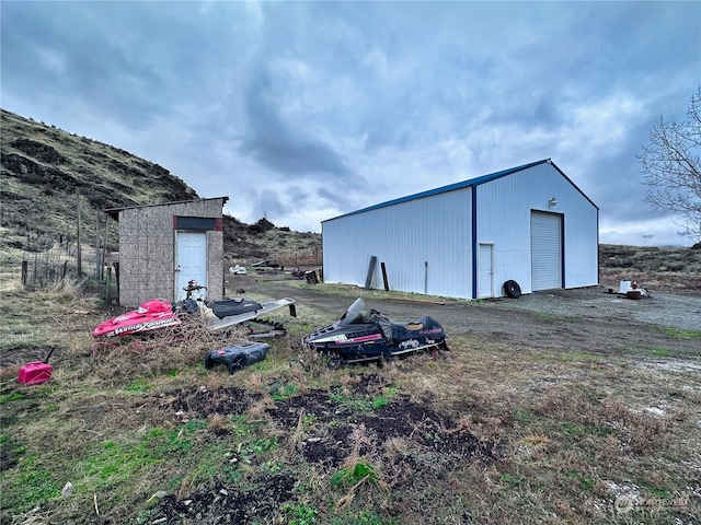 view of outbuilding featuring a garage