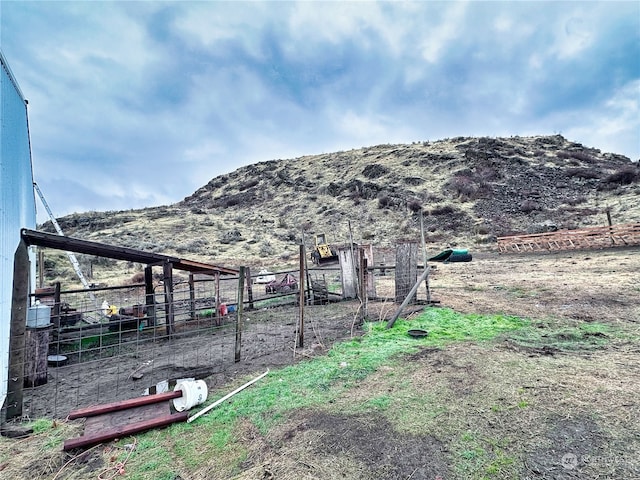 property view of mountains featuring a rural view