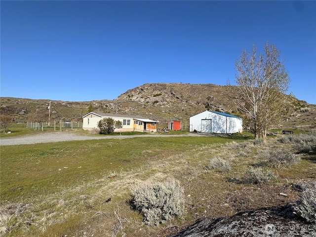 exterior space featuring a garage and a mountain view