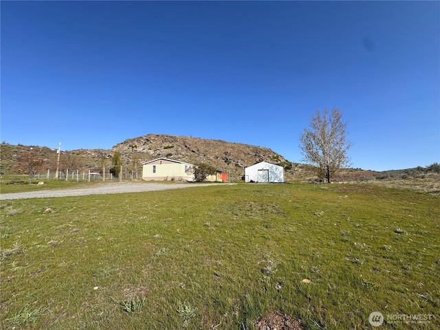 view of yard with a mountain view