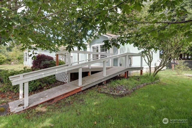 exterior space with a lawn and a wooden deck