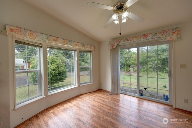 spare room with wood-type flooring, ceiling fan, and lofted ceiling