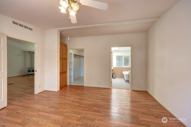 unfurnished room with ceiling fan and light hardwood / wood-style flooring