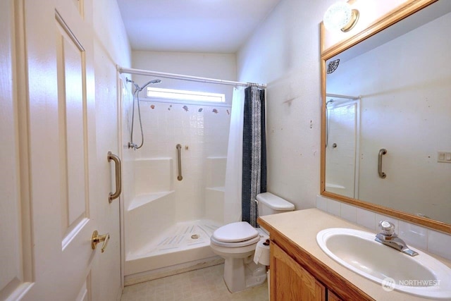 bathroom with a shower with shower curtain, vanity, vaulted ceiling, and toilet