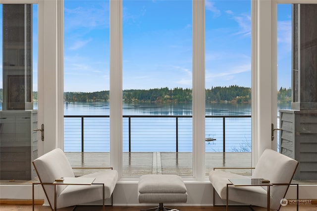 sunroom / solarium with a water view