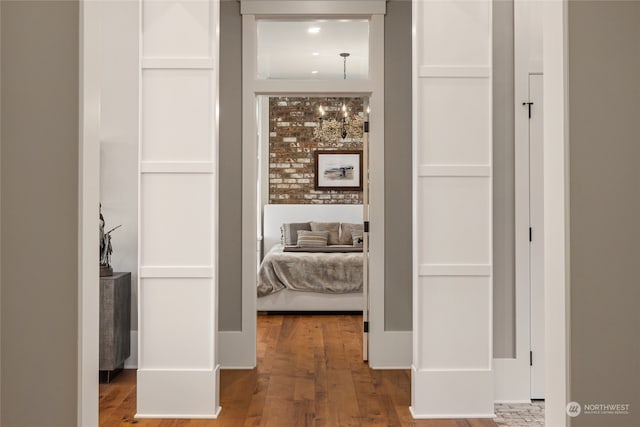 hall with hardwood / wood-style flooring