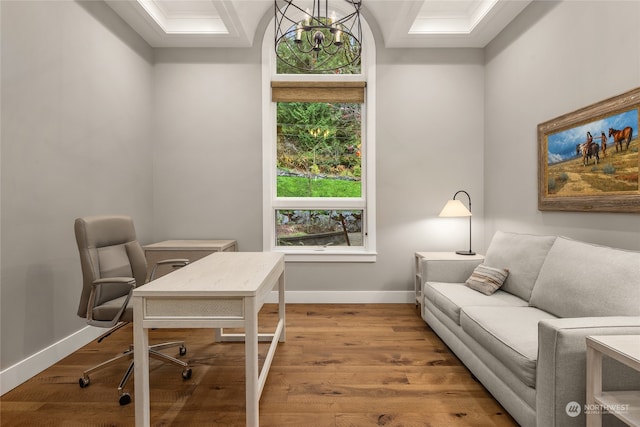 office with crown molding, wood-type flooring, and a notable chandelier