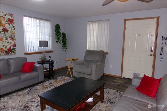 living room featuring hardwood / wood-style flooring and ceiling fan