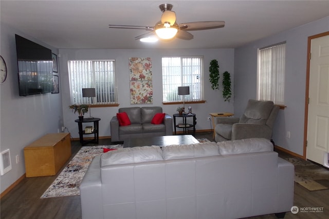 living room with ceiling fan and dark hardwood / wood-style floors