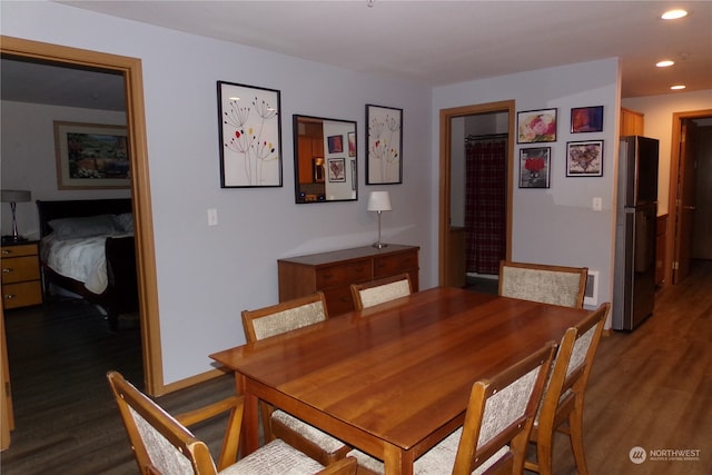 dining area with hardwood / wood-style floors