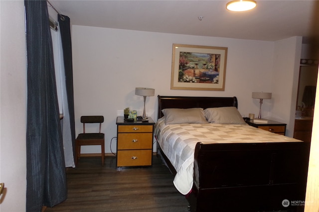 bedroom featuring dark wood-type flooring