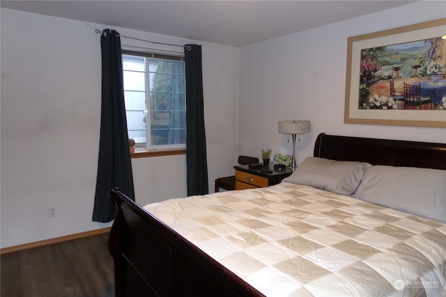 bedroom with hardwood / wood-style flooring