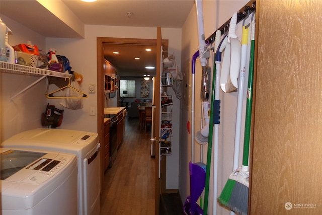 washroom featuring hardwood / wood-style floors and washing machine and dryer