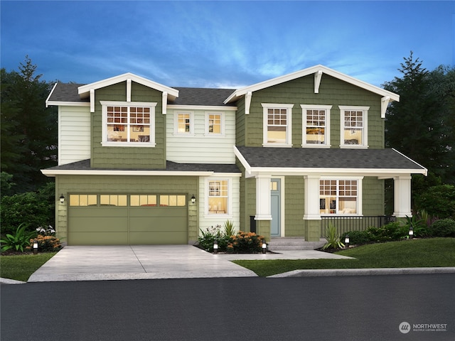 view of front of property with covered porch and a garage