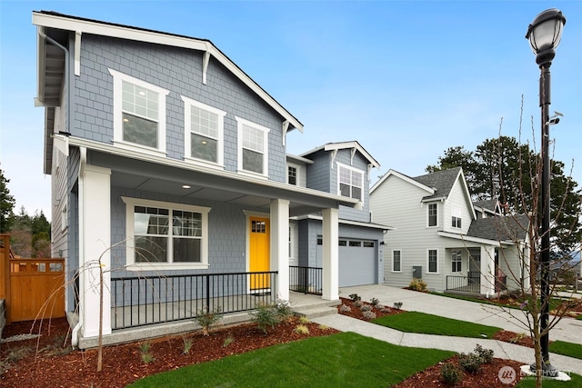 view of front of house with a porch, concrete driveway, and a garage