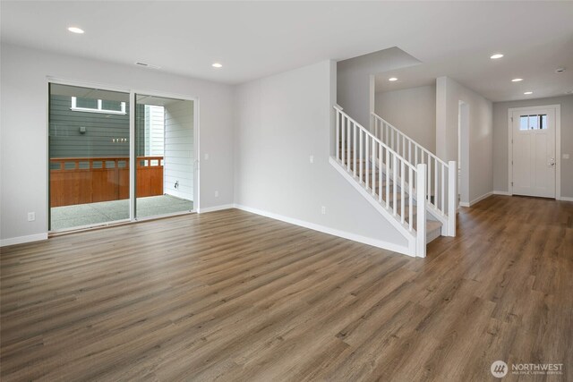 interior space with recessed lighting, stairs, and wood finished floors