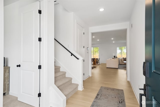 foyer entrance with light wood-type flooring