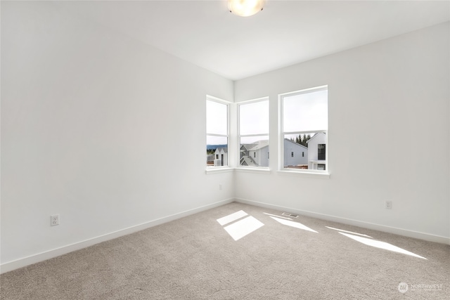 unfurnished room with carpet flooring