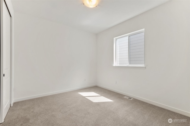 spare room featuring carpet floors