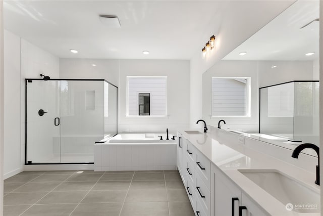 bathroom with tile patterned flooring, vanity, and independent shower and bath