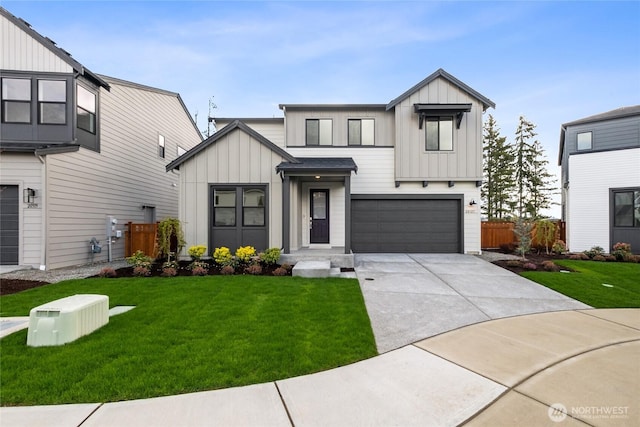 modern farmhouse with concrete driveway, a front lawn, board and batten siding, and an attached garage