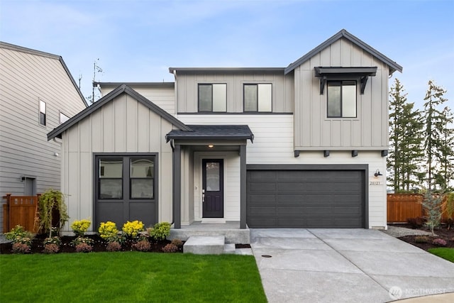 modern farmhouse style home with an attached garage, board and batten siding, driveway, and fence