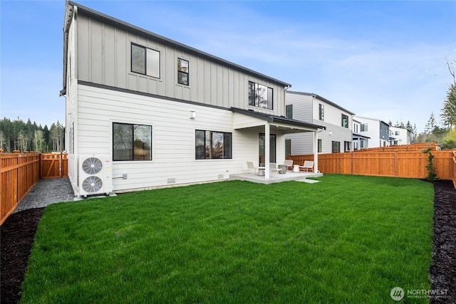 rear view of property featuring board and batten siding, crawl space, a fenced backyard, a lawn, and a patio area