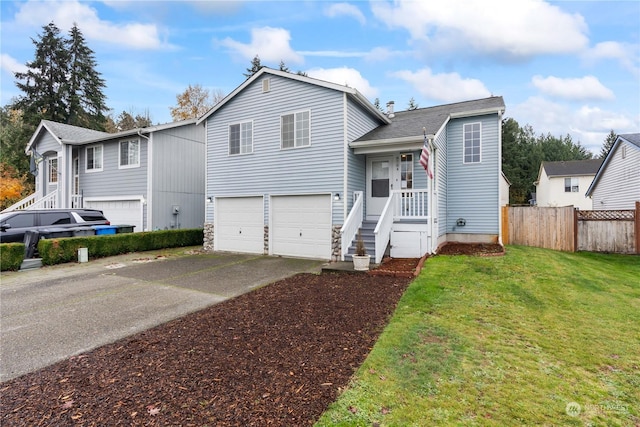 view of front of property with a garage and a front yard