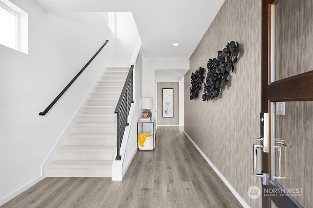 foyer entrance with light hardwood / wood-style floors