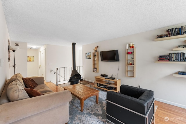 living room featuring hardwood / wood-style floors and a textured ceiling