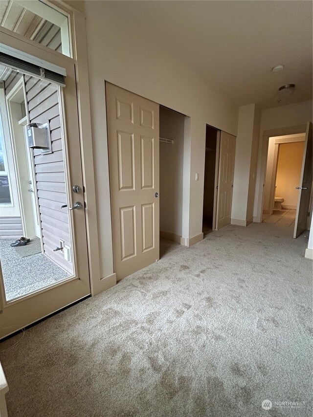 unfurnished bedroom with carpet floors