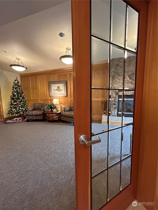 doorway featuring carpet flooring