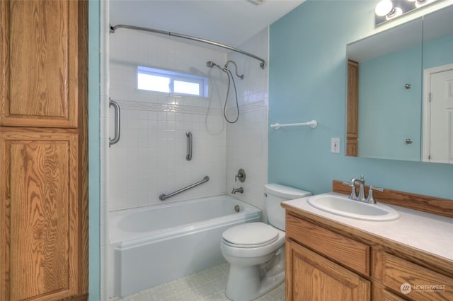 full bathroom featuring vanity, tiled shower / bath combo, and toilet