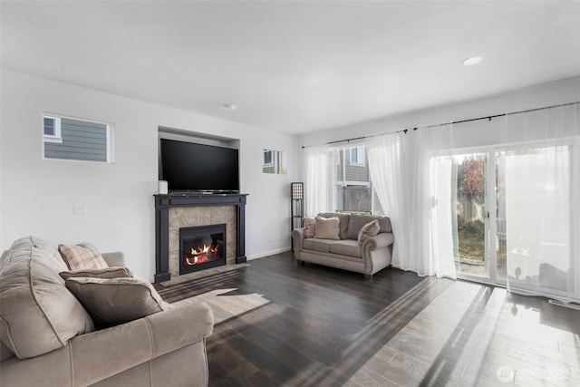 6398 Juanita Cir NE, Bremerton, WA 98311 - living room with a tile fireplace, baseboards, and dark wood finished floors