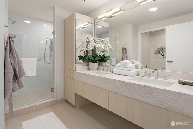 bathroom featuring tile patterned floors, vanity, and an enclosed shower