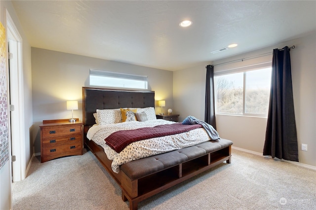 bedroom featuring light colored carpet