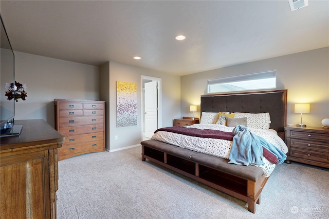 bedroom with light colored carpet