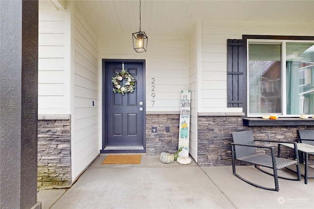 entrance to property featuring a porch