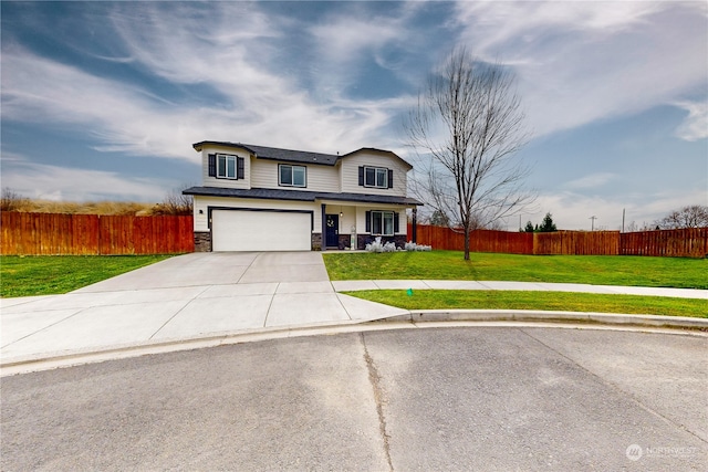 view of front facade with a garage and a front lawn