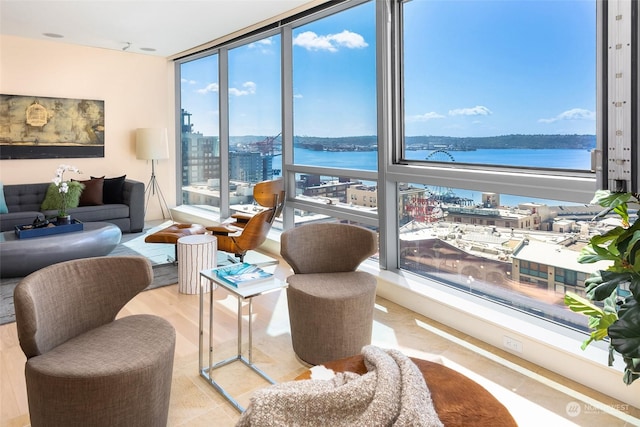 1521 2nd Ave Unit 904, Seattle, WA 98101 - living area featuring a water view, expansive windows, and a city view