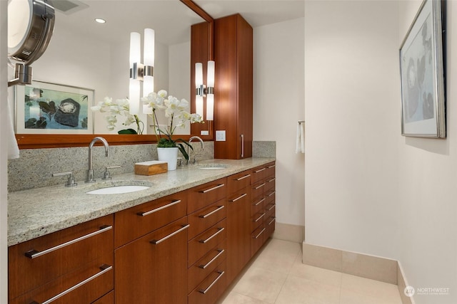 bathroom with decorative backsplash, vanity, and tile patterned floors