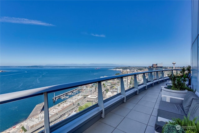 balcony featuring a water view