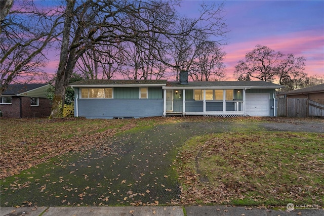 single story home with a garage