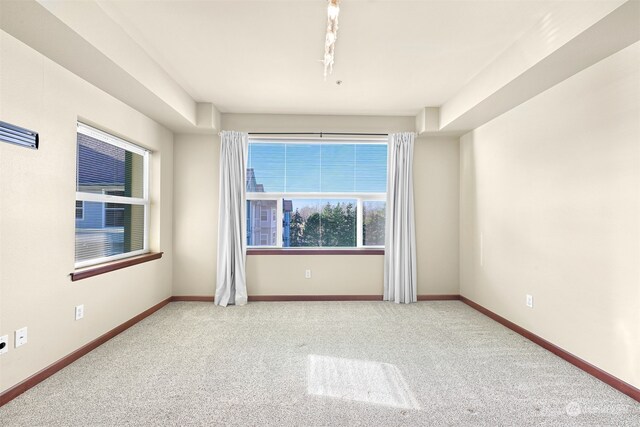 empty room with carpet flooring